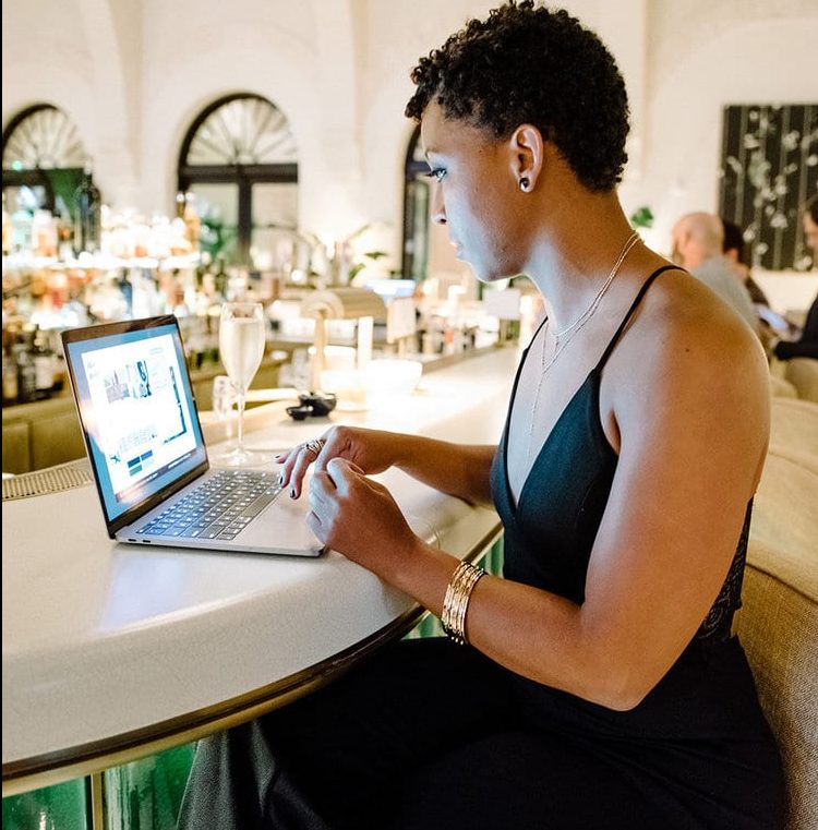 black woman working on fba business listings